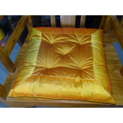 Chair cushion edges in brocade orange...