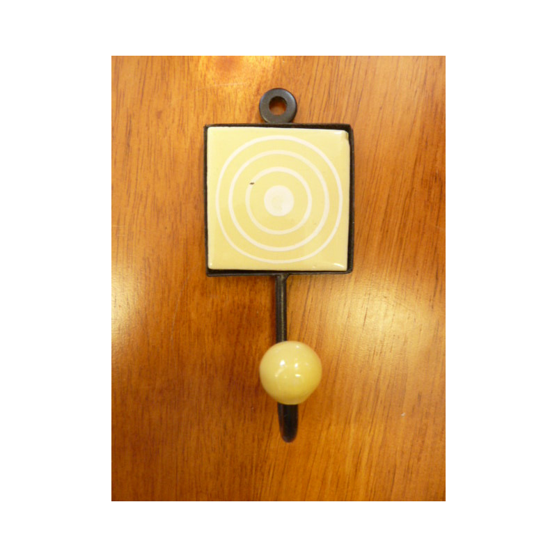 yellow square door hook with white circles
