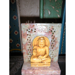 Statuette of buddha seating en...